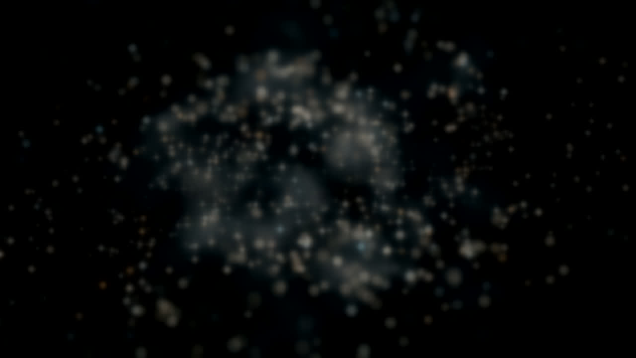Abstract field of warm out-of-focus light points receding into darkness